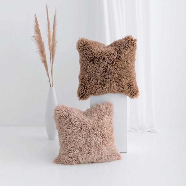 Buy and Save on The Hahndorf Sheepskin Cushions Cushions | Add a touch of luxury and pure comfort to your home with the delicate feel of long wool curly sheepskin. With two warm and neutral colours these cushions are a staple for all year around providing