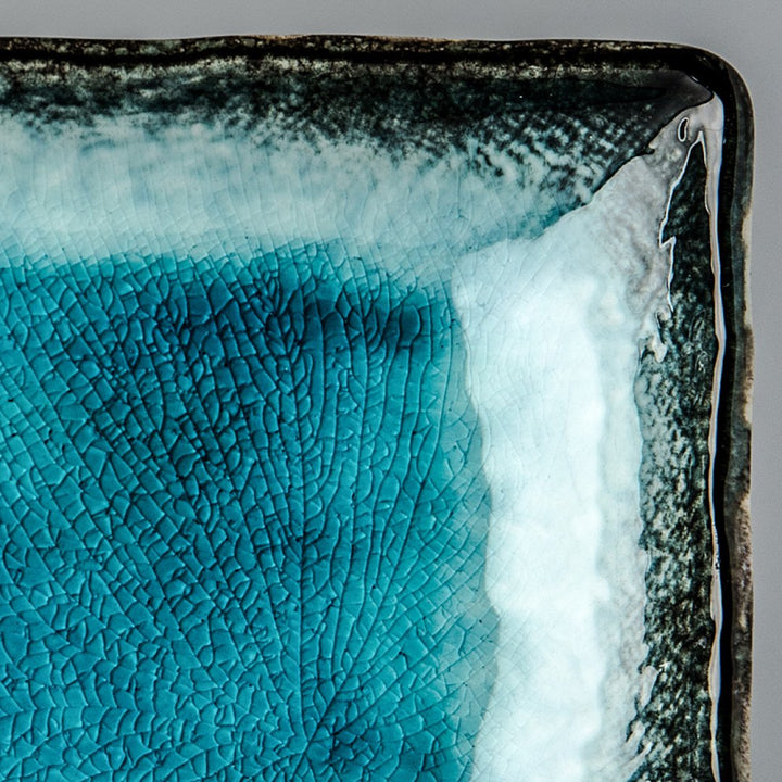 Save on Sky Blue Sashimi Plate Made in Japan at BEON. 29cm length x 12cm width. Sashimi Plate in Sky Blue design.The sky blue glaze is fired at a low temperature to create a unique 'crackle' effect over a deep and vibrant blue background. Traditionally used for sashimi but can be used for sushi, dumplings and rice paper rolls. This beautiful glaze makes any food look amazing. Handcrafted in Japan CRACKLE GLAZES - The spectacular glazes that look like cracked glass on the surface require slightly more care t