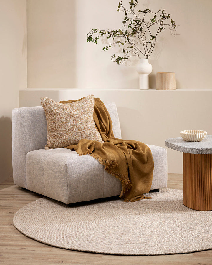 Altona Throw Add a pared-back accent to your space with the lightweight softness of Altona. Finely woven from a blend of wool and recycled polyester, the solid colour and delicate fringe edge makes this piece easy to style into most interior schemes. The