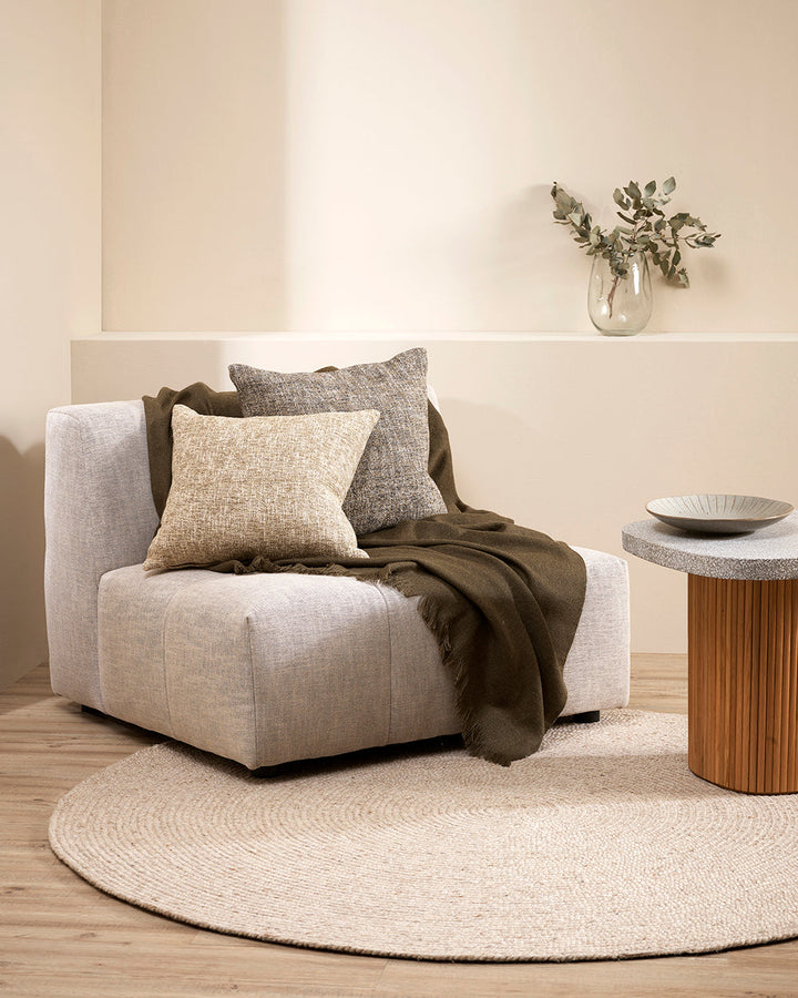 Altona Throw Add a pared-back accent to your space with the lightweight softness of Altona. Finely woven from a blend of wool and recycled polyester, the solid colour and delicate fringe edge makes this piece easy to style into most interior schemes. The