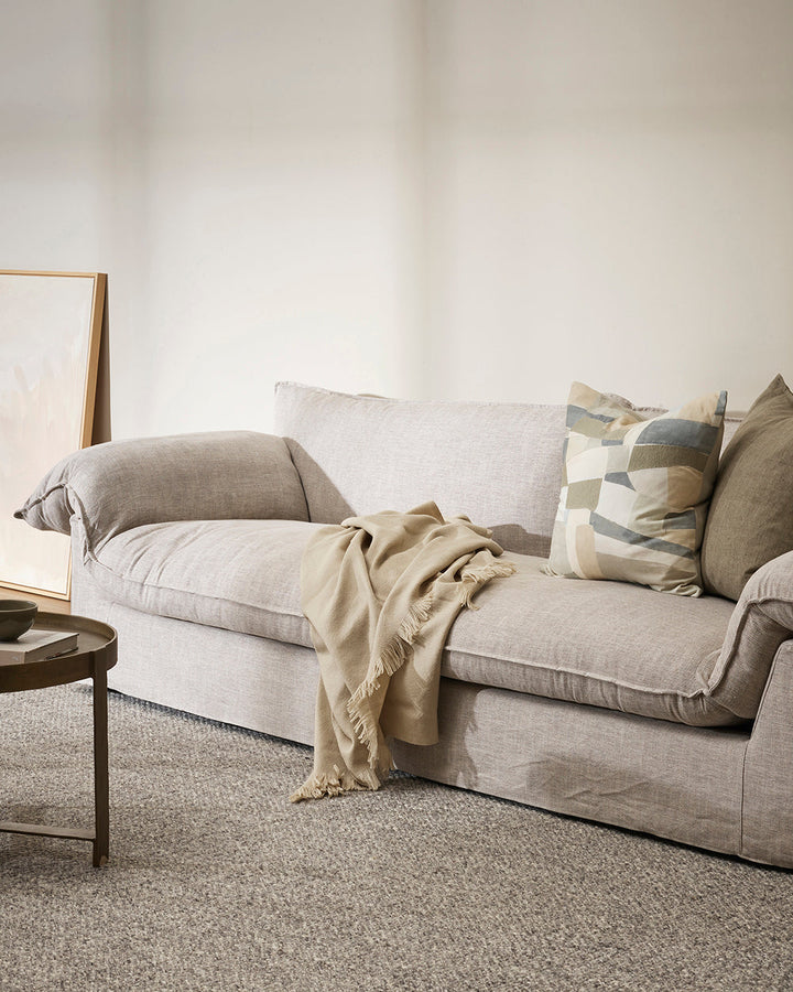 Altona Throw Add a pared-back accent to your space with the lightweight softness of Altona. Finely woven from a blend of wool and recycled polyester, the solid colour and delicate fringe edge makes this piece easy to style into most interior schemes. The
