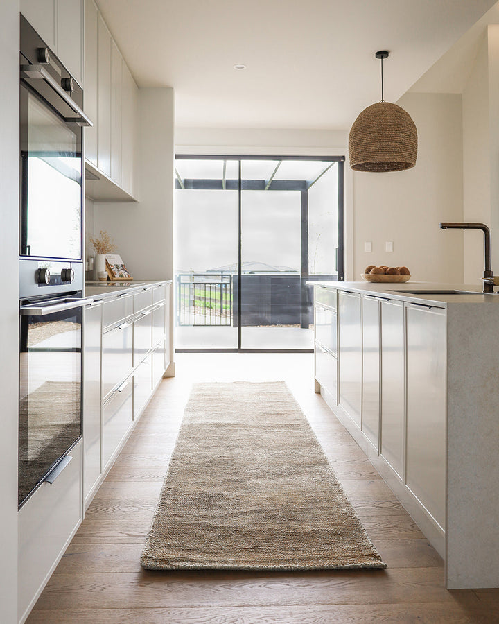 Anchorage Floor Runner Create a welcoming entrance or passageway with this simple, natural fibre runner. A blend of bamboo and jute yarns gives the tufted surface subtle colour graduations, while the sand tone gives a thoughtfully crafted, natural feel to