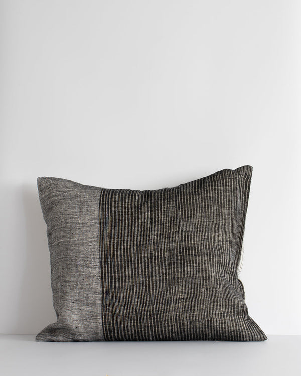 Anderson Cushion Embrace contemporary luxury with the artisan weave of our Anderson cushion. Crafted in a cool monochromatic palette in an off-set stripe, this double-sided design in 100% linen provides a simple, textural aesthetic for a modern living spa