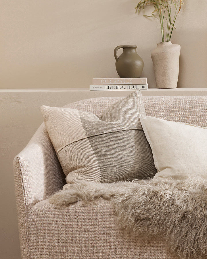 Antoine Cushion Set a relaxed tone with a modern take on country style. Crafted from thick, textural cotton, the Antoine features an asymmetric plaid design in jacquard weave. Soft sage and ivory tones come together to convey an inviting and comforting ae