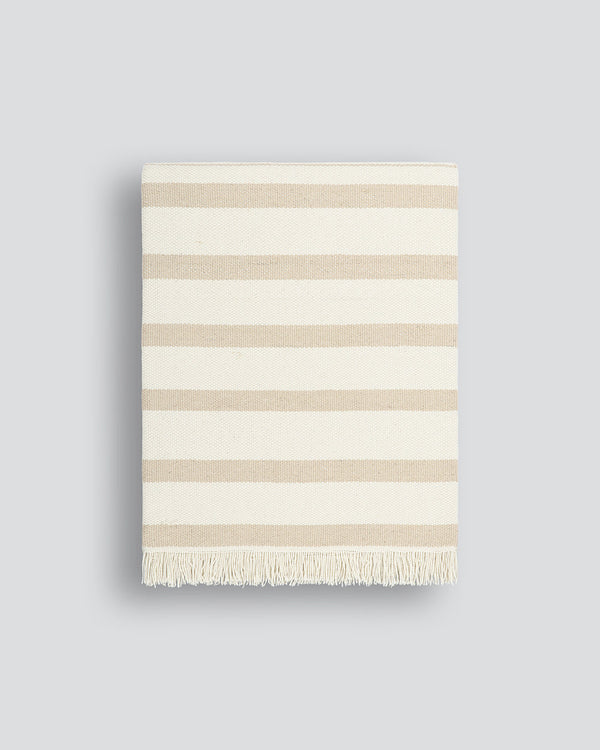 Banksia Throw A relaxed sense of living is reflected in the understated design of our Banksia throw. Woven from soft PET yarn, the inherent durability of this fibre allows this piece to transition from outside at the pool, to indoors on the couch. This pi