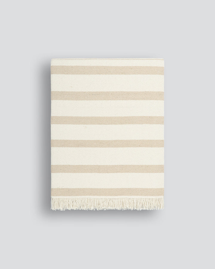 Banksia Throw A relaxed sense of living is reflected in the understated design of our Banksia throw. Woven from soft PET yarn, the inherent durability of this fibre allows this piece to transition from outside at the pool, to indoors on the couch. This pi