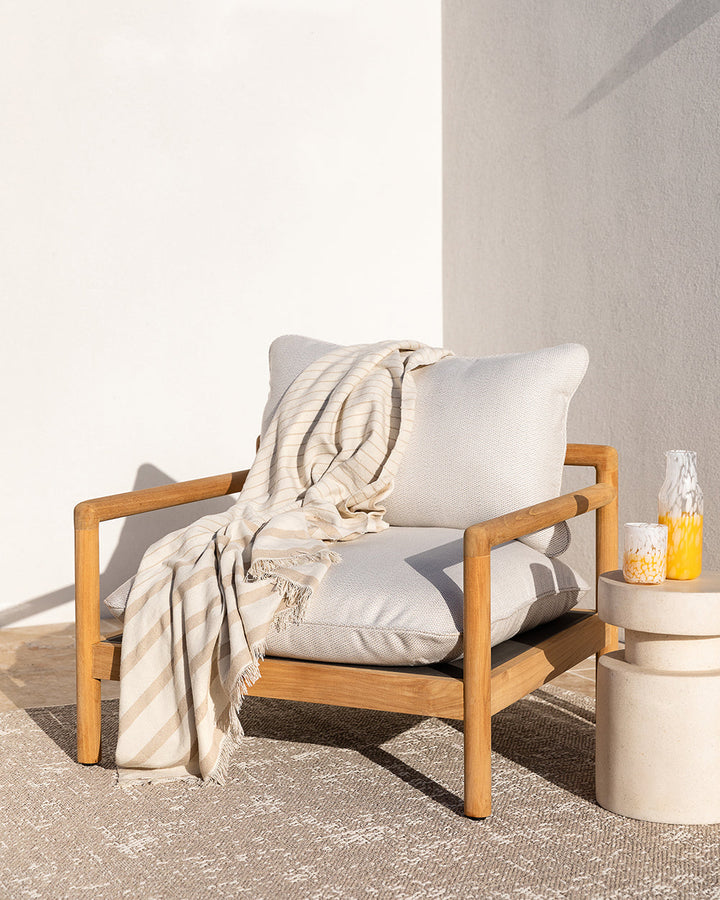 Banksia Throw A relaxed sense of living is reflected in the understated design of our Banksia throw. Woven from soft PET yarn, the inherent durability of this fibre allows this piece to transition from outside at the pool, to indoors on the couch. This pi