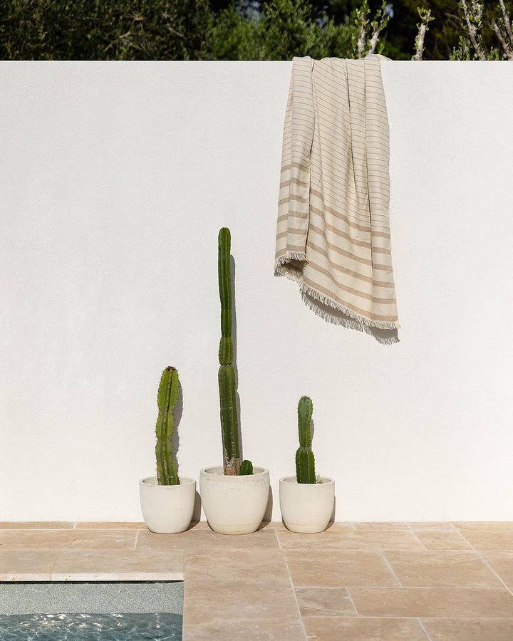 Banksia Throw A relaxed sense of living is reflected in the understated design of our Banksia throw. Woven from soft PET yarn, the inherent durability of this fibre allows this piece to transition from outside at the pool, to indoors on the couch. This pi