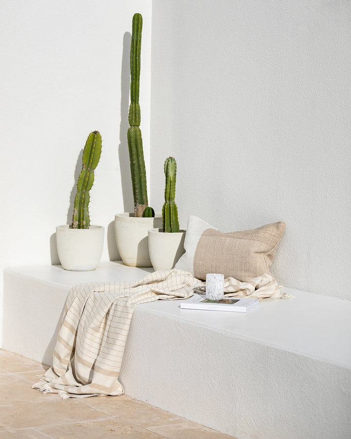 Banksia Throw A relaxed sense of living is reflected in the understated design of our Banksia throw. Woven from soft PET yarn, the inherent durability of this fibre allows this piece to transition from outside at the pool, to indoors on the couch. This pi