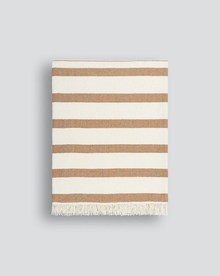 Banksia Throw A relaxed sense of living is reflected in the understated design of our Banksia throw. Woven from soft PET yarn, the inherent durability of this fibre allows this piece to transition from outside at the pool, to indoors on the couch. This pi