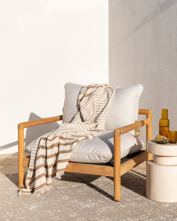 Banksia Throw A relaxed sense of living is reflected in the understated design of our Banksia throw. Woven from soft PET yarn, the inherent durability of this fibre allows this piece to transition from outside at the pool, to indoors on the couch. This pi