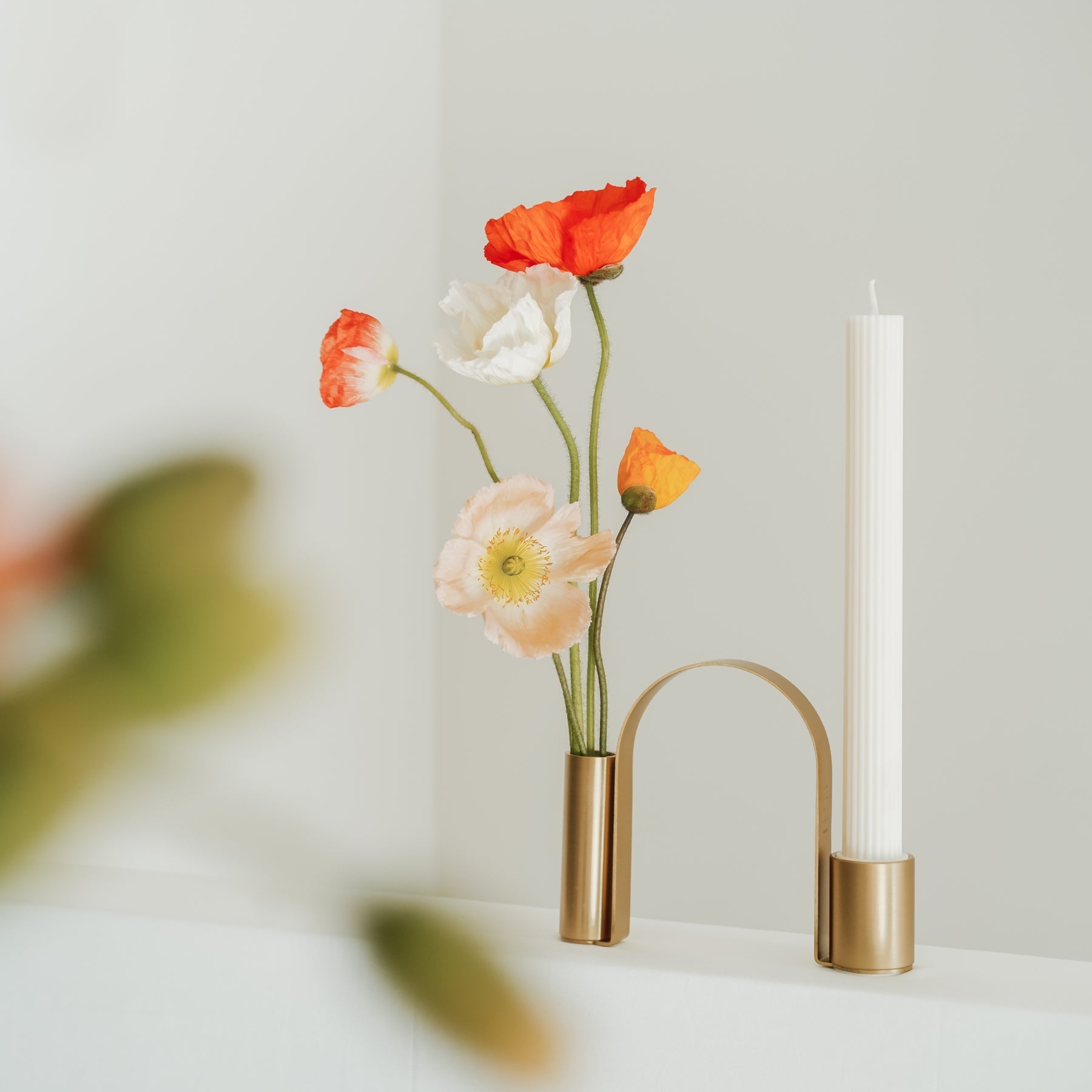 The Arch Brass Holder adds instant graphic appeal to a room. More than just a candle holder, the gently curved arch-like stand can be used as a vase to bring elegance and visual intrigue to spaces.