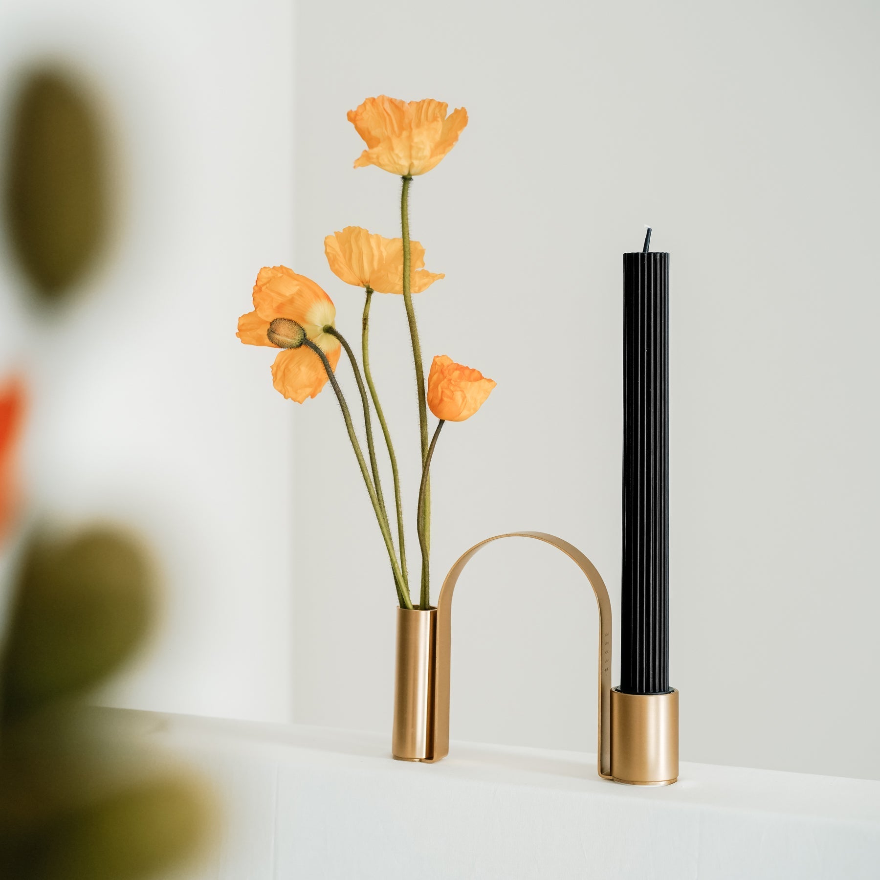 The Arch Brass Holder adds instant graphic appeal to a room. More than just a candle holder, the gently curved arch-like stand can be used as a vase to bring elegance and visual intrigue to spaces.