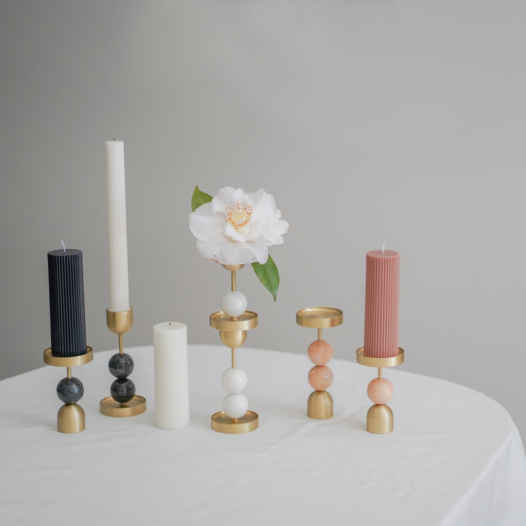 A perfect addition to our column candle collection. This brass candle holder can be used in two ways and easy to create a candle group setting. The plate design also c
