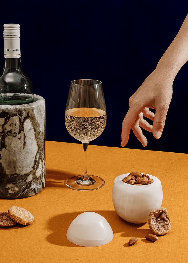 Eggshell Stone Storage Accessories Available at BEON | Crafted from exquisite white onyx with a matte finish, our Eggshell Stone Storage embodies minimalist elegance. Its egg-shaped design adds a touch of intrigue, making it perfect for table-top decor or