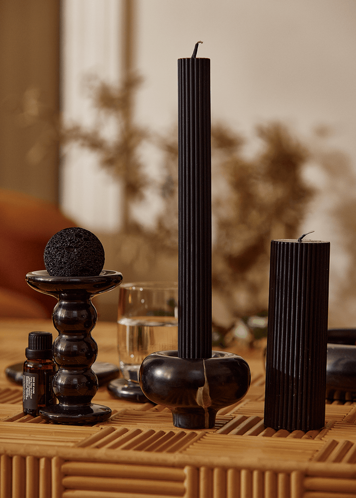 Halo Candle Holder Pillar Candle Available at BEON | Dramatic arcs define the unique charm of the Halo Candle Holder. Its rounded top and slender base capture the essence of mid-century style, exuding an aura of elegance. The stackable design offers versa