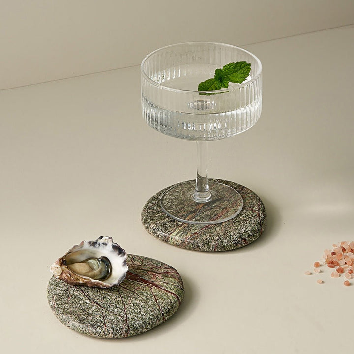 Stone Coaster Set - Rainforest Green Accessories Available at BEON | Experience nature's embrace with the irregular circular design of the Stone Coaster. Handcrafted with meticulous attention to detail, each coaster possesses its distinct character, makin