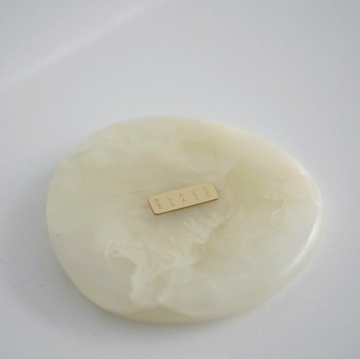 Stone Coaster Set - White Onyx Accessories Available at BEON | Experience nature's embrace with the irregular circular design of the Stone Coaster. Handcrafted with meticulous attention to detail, each coaster possesses its distinct character, making ever