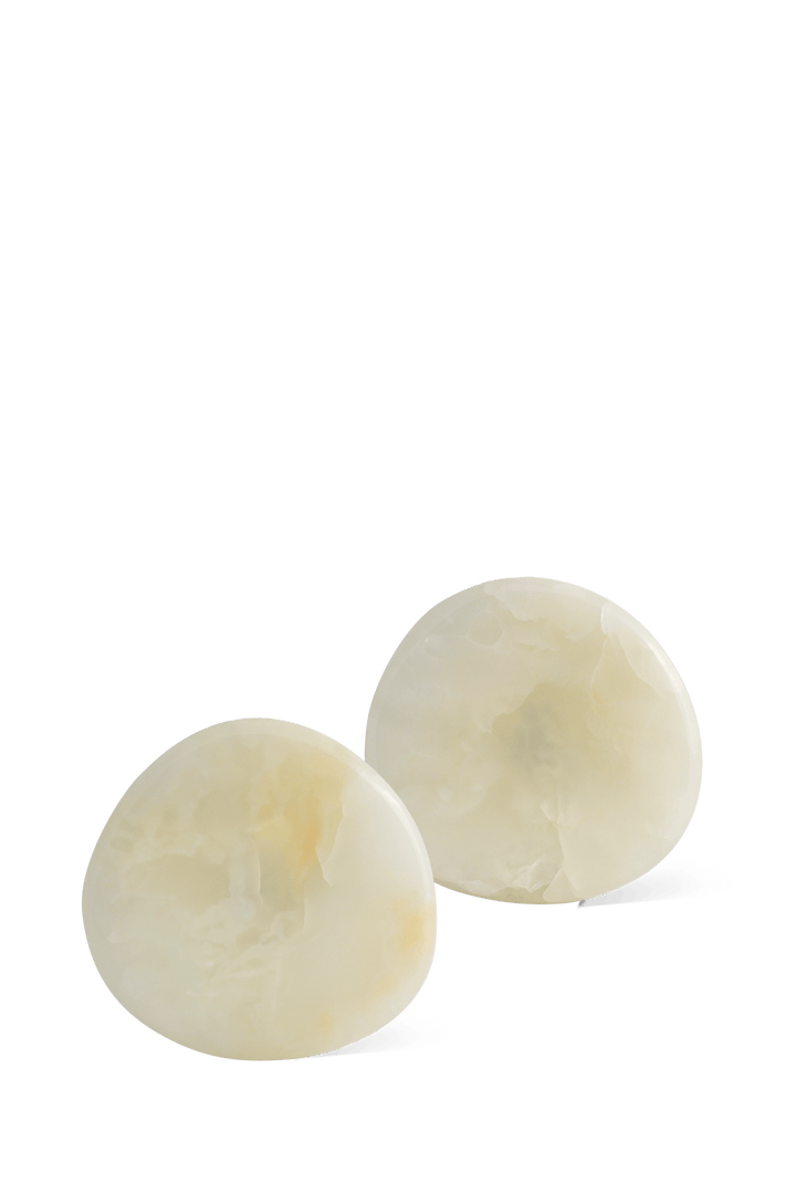 Stone Coaster Set - White Onyx Accessories Available at BEON | Experience nature's embrace with the irregular circular design of the Stone Coaster. Handcrafted with meticulous attention to detail, each coaster possesses its distinct character, making ever