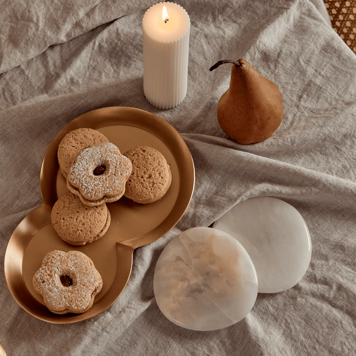 Stone Coaster Set - White Onyx Accessories Available at BEON | Experience nature's embrace with the irregular circular design of the Stone Coaster. Handcrafted with meticulous attention to detail, each coaster possesses its distinct character, making ever