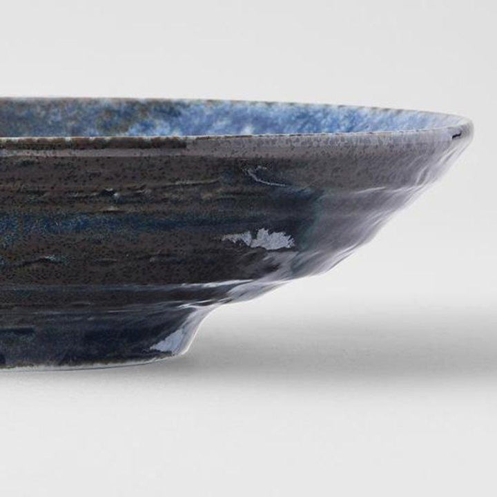 Save on Midnight Blue Open Bowl Made in Japan at BEON. 22cm diameter x 5cm height Open bowl in Midnight Blue design Featuring a dark indigo gloss with subtle brown undertones. The glaze runs over a pattern of concentric circles. It works in perfect harmony with the rustic shapes made by the kiln. This open bowl is a great shape for sharing dishes. Use for pasta, curries, risottos or salads. Handcrafted in Japan.Microwave and dishwasher safe.