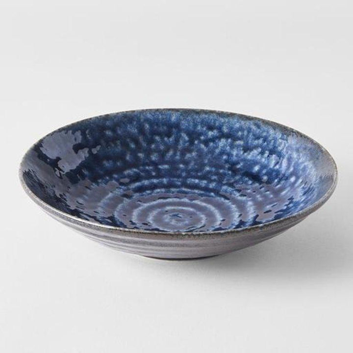 Save on Midnight Blue Open Bowl Made in Japan at BEON. 22cm diameter x 5cm height Open bowl in Midnight Blue design Featuring a dark indigo gloss with subtle brown undertones. The glaze runs over a pattern of concentric circles. It works in perfect harmony with the rustic shapes made by the kiln. This open bowl is a great shape for sharing dishes. Use for pasta, curries, risottos or salads. Handcrafted in Japan.Microwave and dishwasher safe.