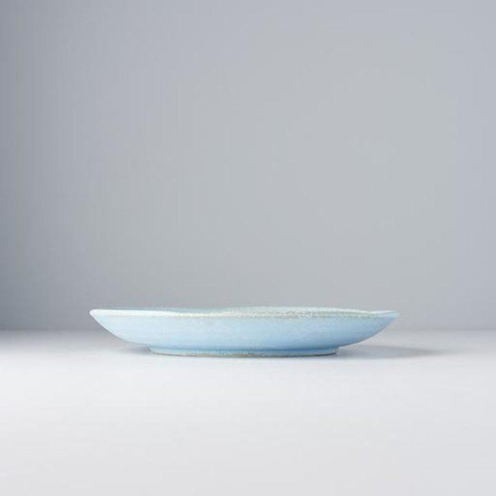 Save on Soda Blue Uneven Plate Made in Japan at BEON. 24.5cm diameter x 3cm height Uneven plate in Soda Blue design The Soda Blue range features a soft pastel blue, highlighted by a gentle play of white. Each piece has a unique pattern determined by its position in the kiln during the firing process. The perfect size plate to use as an everyday dinner plate or to use on special occasions. Handcrafted in JapanMicrowave and dishwasher safe