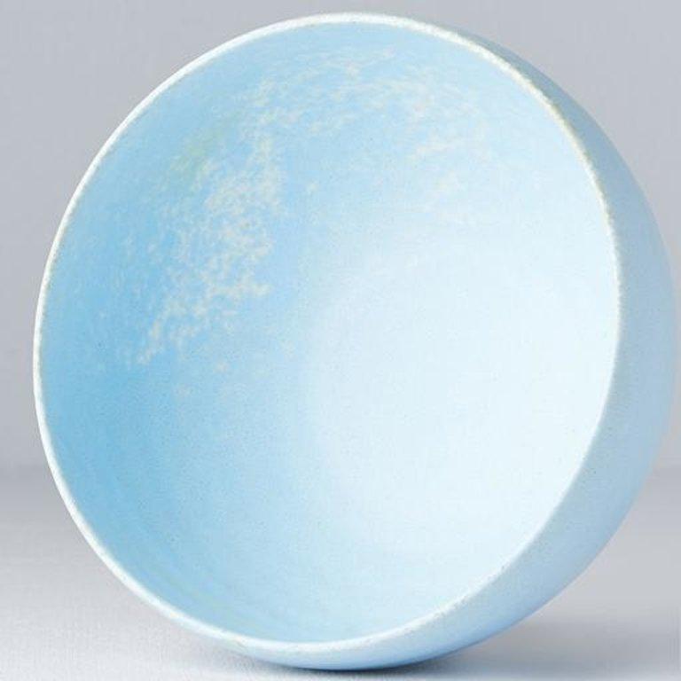Save on Soda Blue Medium U Shape Bowl Made in Japan at BEON. 13cm diameter x 7.5cm height Medium U shape bowl in Soda Blue design The Soda Blue range features a soft pastel blue, highlighted by a gentle play of white. Each piece has a unique pattern determined by its position in the kiln during the firing process. Use this bowl for your favourite breakfast cereals, desserts or as a rice bowl. Handcrafted in JapanMicrowave and dishwasher safe.