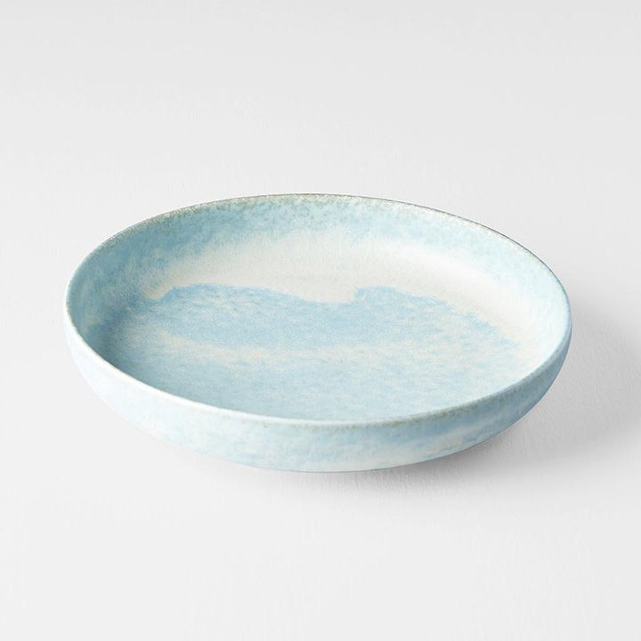 Save on Soda Blue High Rim Plate Made in Japan at BEON. 20cm diameter x 4cm height. High rim plate in Soda Blue design The Soda Blue range features a soft pastel blue, highlighted by a gentle play of white. Each piece has a unique pattern determined by its position in the kiln during the firing process. This high rim shape is the perfect plate to serve risottos, pasta or steak. Use as an everyday plate or when entertaining guests at dinner parties. Handcrafted in JapanMicrowave and dishwasher safe