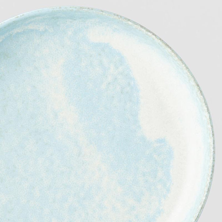 Save on Soda Blue High Rim Plate Made in Japan at BEON. 20cm diameter x 4cm height. High rim plate in Soda Blue design The Soda Blue range features a soft pastel blue, highlighted by a gentle play of white. Each piece has a unique pattern determined by its position in the kiln during the firing process. This high rim shape is the perfect plate to serve risottos, pasta or steak. Use as an everyday plate or when entertaining guests at dinner parties. Handcrafted in JapanMicrowave and dishwasher safe