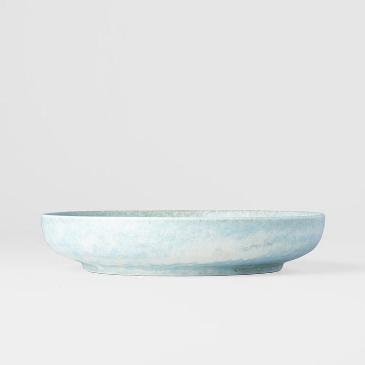 Save on Soda Blue High Rim Plate Made in Japan at BEON. 20cm diameter x 4cm height. High rim plate in Soda Blue design The Soda Blue range features a soft pastel blue, highlighted by a gentle play of white. Each piece has a unique pattern determined by its position in the kiln during the firing process. This high rim shape is the perfect plate to serve risottos, pasta or steak. Use as an everyday plate or when entertaining guests at dinner parties. Handcrafted in JapanMicrowave and dishwasher safe