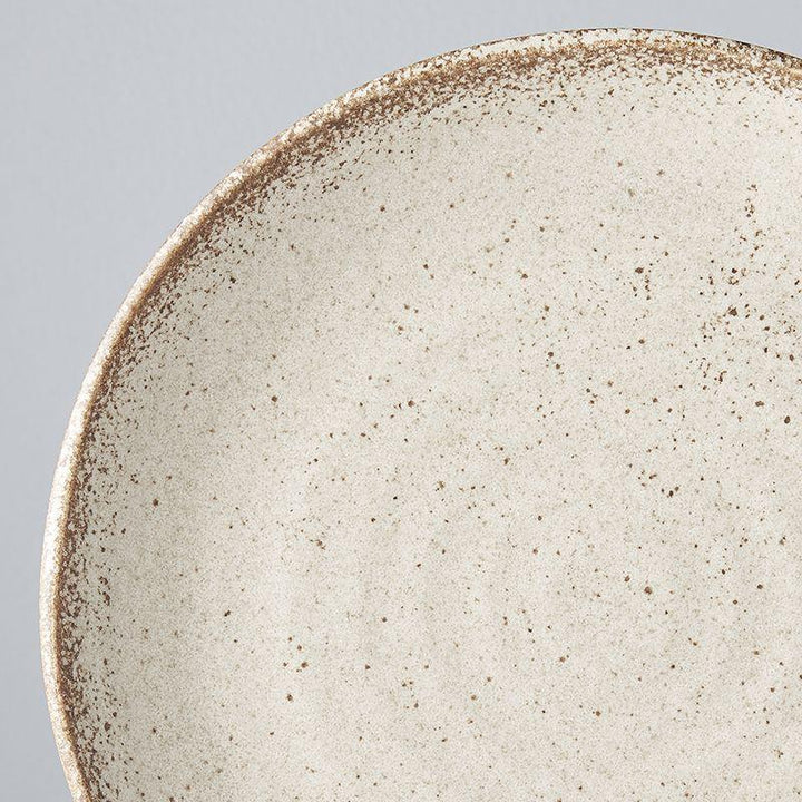 Save on Sand Fade Uneven Plate Made in Japan at BEON. 24.5cm diameter x 3cm height Uneven plate in Sand Fade Design The Sand Fade Glaze features a warm, sandy tone with touches of hazel brown. Each piece has a unique speckled pattern determined by its position in the kiln during the firing process. The perfect size plate to use as an everyday dinner plate or to use on special occasions. Handcrafted in JapanMicrowave and dishwasher safe