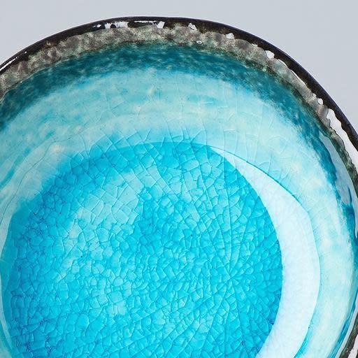 Save on Sky Blue Round Sauce Dish Made in Japan at BEON. 8cm diameter x 3cm height Round sauce dish in Sky Blue The sky blue glaze is fired at a low temperature to create a unique 'crackle' effect over a deep and vibrant blue background. A perfect dish for sauces to accompany dumplings, spring rolls and sausage rolls. Handcrafted in Japan CRACKLE GLAZES - The spectacular glazes that look like cracked glass on the surface require slightly more care than our regular products. Don’t use in a microwave - The he