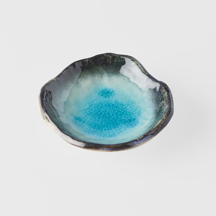 Save on Sky Blue Sauce Dish With Feet Made in Japan at BEON. 9cm diameter x 2.5cm Sauce Dish with feet in Sky Blue design.The sky blue glaze is fired at a low temperature to create a unique 'crackle' effect over a deep and vibrant blue background. Use for dipping sauces or sea salt on a table setting. Handcrafted in Japan CRACKLE GLAZES - The spectacular glazes that look like cracked glass on the surface require slightly more care than our regular products. Don’t use in a microwave - The heat can open the c