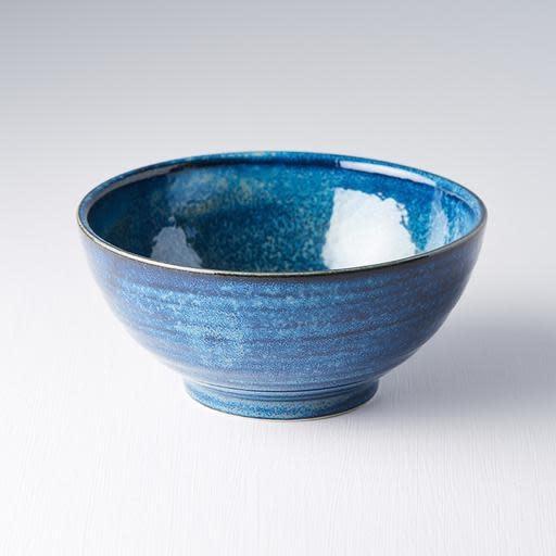 Save on Indigo Blue Medium U Shaped Bowl Made in Japan at BEON. 18cm diameter x 9cm height. Medium U Shaped bowl in indigo blue design. The Indigo Blue range is a popular glaze due the richness and depth of colour. A unique dappling effect means no two are the same. The deep shape of this bowl is perfect for soups, noodles, pasta and risottos. Handcrafted in Japan. Microwave and dishwasher safe.