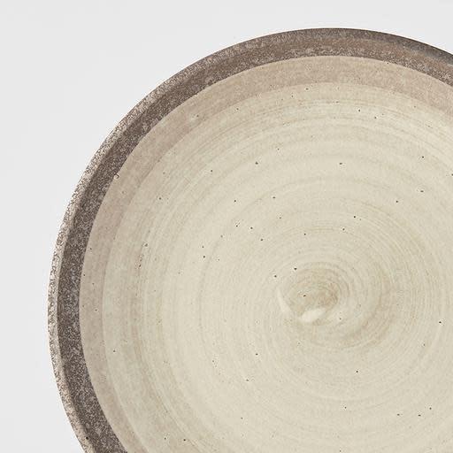 Save on Nin-Rin Dinner Plate Made in Japan at BEON. 25cm diameter x 3.5 height Dinner plate in Nin-Rin design The Nin-Rin range features a circular sweep of golden ochre over the signature 'Earth' glaze. No two pieces are the same due to a unique hand glazing technique used to create the swirling pattern. These are great to use as everyday dinner plates or serving plates when entertaining guests.Handcrafted in JapanDishwasher and microwave safe