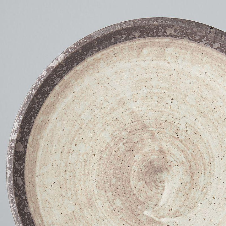 Save on Nin-Rin Side Plate Made in Japan at BEON. 20cm diameter x 3cm height Side Plate in Nin-Rin design The Nin-Rin range features a circular sweep of golden ochre over the signature 'Earth' glaze. No two pieces are the same due to a unique hand glazing technique used to create the swirling pattern. This is a great size plate to use as a starter plate, for desserts or as a side plate for bread to accompany soup or casseroles. Handcrafted in JapanMicrowave and dishwasher safe