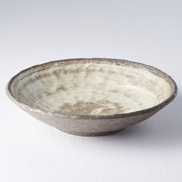 Save on Nin-Rin Large Shallow Bowl Made in Japan at BEON. 24cm diameter x 5.5cm height Large Shallow Bowl in Nin-Rin design The Nin-Rin range features a circular sweep of golden ochre over the signature 'Earth' glaze. No two pieces are the same due to a unique hand glazing technique used to create the swirling pattern. This large shallow bowl is a great shape for sharing dishes. Use for pasta, curries, risottos or salads. Handcrafted in Japan.Microwave and dishwasher safe.