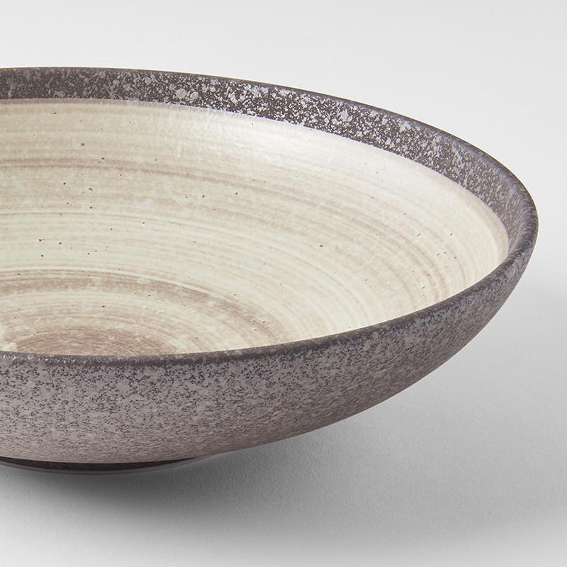 Save on Nin-Rin Open Serving Bowl Made in Japan at BEON. 28cm diameter x 7.5 height Open shape serving bowl in Nin-Rin Design The Nin-Rin range features a circular sweep of golden ochre over the signature 'Earth' glaze. No two pieces are the same due to a unique hand glazing technique used to create the swirling pattern. Great piece for table centrepiece, or as a main focus of a buffet style meal serving salads and pasta. Top selling bowl that makes a great gift.Handcrafted in JapanMicrowave and Dishwasher