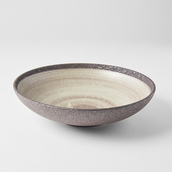 Save on Nin-Rin Open Serving Bowl Made in Japan at BEON. 28cm diameter x 7.5 height Open shape serving bowl in Nin-Rin Design The Nin-Rin range features a circular sweep of golden ochre over the signature 'Earth' glaze. No two pieces are the same due to a unique hand glazing technique used to create the swirling pattern. Great piece for table centrepiece, or as a main focus of a buffet style meal serving salads and pasta. Top selling bowl that makes a great gift.Handcrafted in JapanMicrowave and Dishwasher