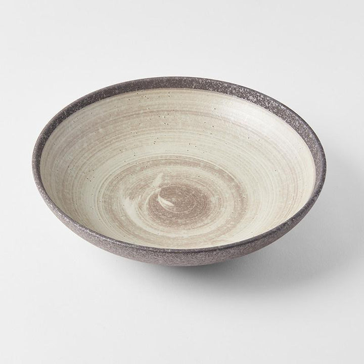 Save on Nin-Rin Open Serving Bowl Made in Japan at BEON. 28cm diameter x 7.5 height Open shape serving bowl in Nin-Rin Design The Nin-Rin range features a circular sweep of golden ochre over the signature 'Earth' glaze. No two pieces are the same due to a unique hand glazing technique used to create the swirling pattern. Great piece for table centrepiece, or as a main focus of a buffet style meal serving salads and pasta. Top selling bowl that makes a great gift.Handcrafted in JapanMicrowave and Dishwasher