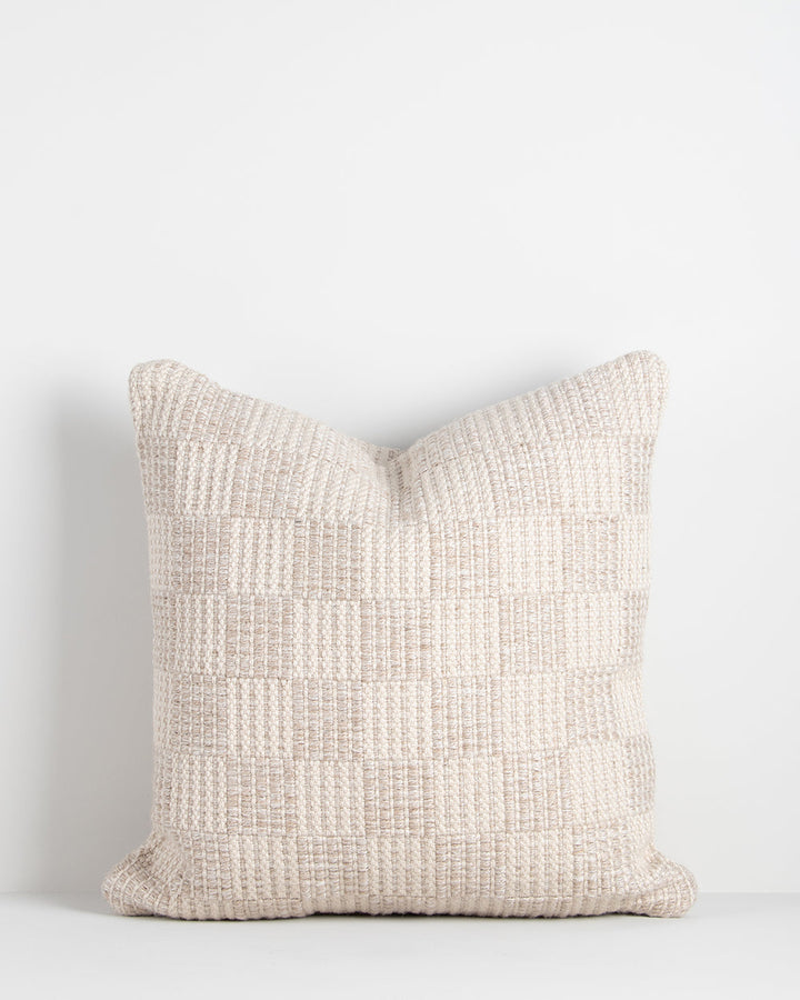 Carter Cushion Elevate your outdoors with the soft nougat and almond tones of our Carter cushion. Handwoven in a textural check design, this versatile piece transitions seamlessly to indoor settings. This piece is crafted using PET yarn, a resilient fibre