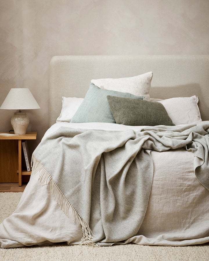 Casa Throw Beautifully soft and lightweight, the Casa adds an unparallel sense of timeless luxury to a space. Woven in a two-tone, reversible design, the merino composition feels inviting and cocoon-like, while the warm charcoal tone adds a gentle contras