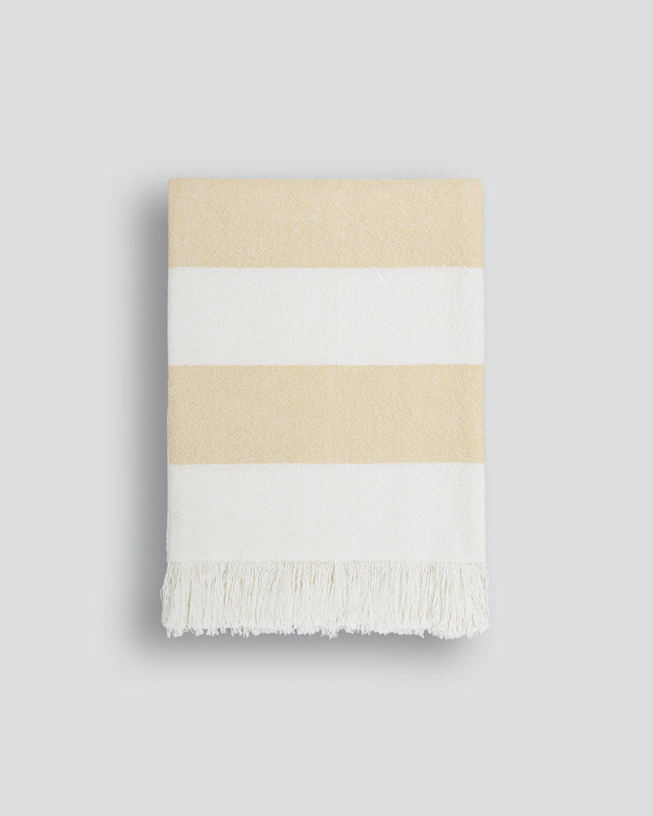 Cheltenham Throw Add a touch of summer to your home with this Cheltenham Throw. Made of 100% cotton, it features a wide stripe design in a delicate powdery blue color. The cross-woven pattern with white detailing and frayed edges brings to mind carefree p