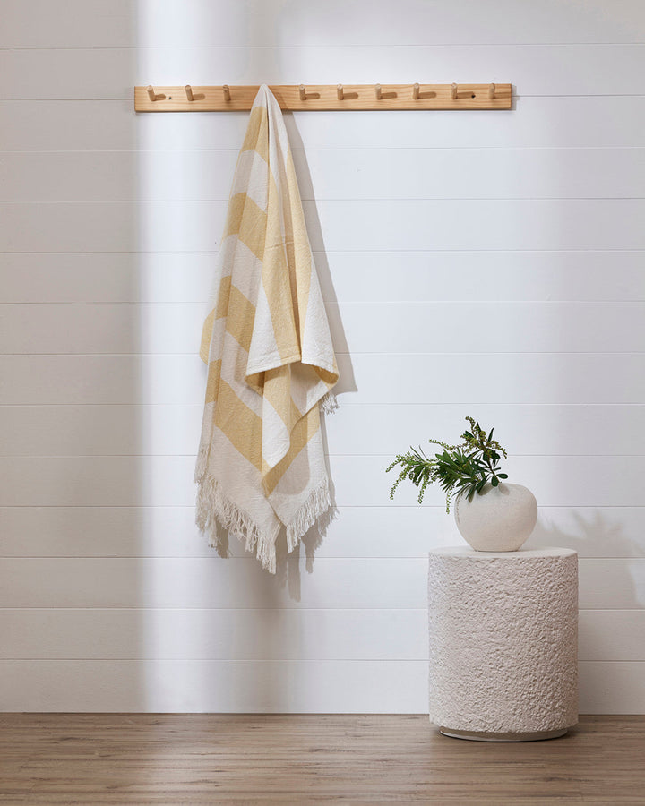 Cheltenham Throw Add a touch of summer to your home with this Cheltenham Throw. Made of 100% cotton, it features a wide stripe design in a delicate powdery blue color. The cross-woven pattern with white detailing and frayed edges brings to mind carefree p