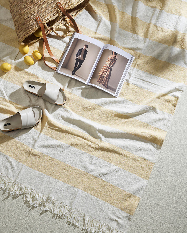 Cheltenham Throw Add a touch of summer to your home with this Cheltenham Throw. Made of 100% cotton, it features a wide stripe design in a delicate powdery blue color. The cross-woven pattern with white detailing and frayed edges brings to mind carefree p