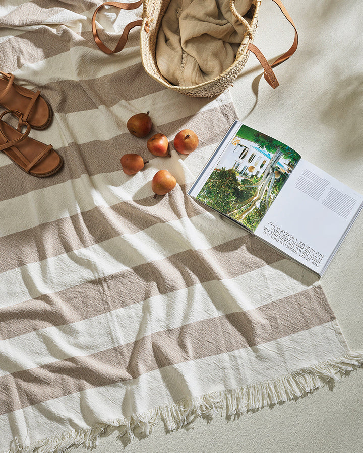 Cheltenham Throw Add a touch of summer to your home with this Cheltenham Throw. Made of 100% cotton, it features a wide stripe design in a delicate powdery blue color. The cross-woven pattern with white detailing and frayed edges brings to mind carefree p