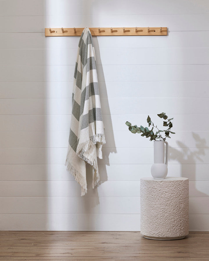 Cheltenham Throw Add a touch of summer to your home with this Cheltenham Throw. Made of 100% cotton, it features a wide stripe design in a delicate powdery blue color. The cross-woven pattern with white detailing and frayed edges brings to mind carefree p