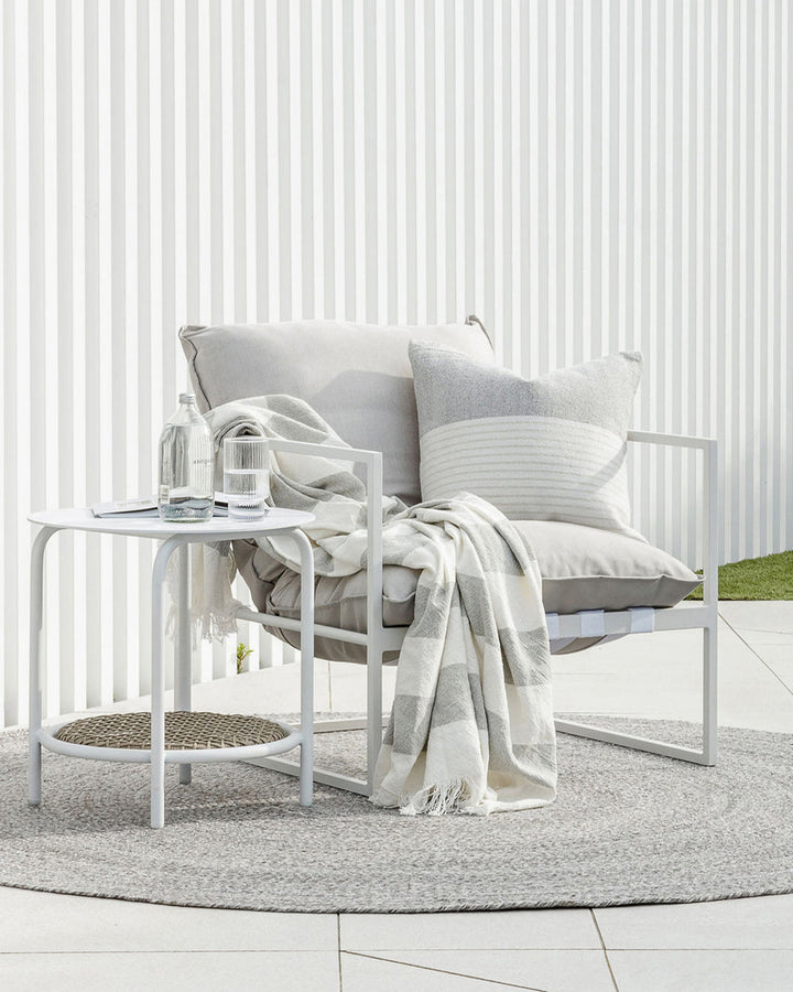 Cheltenham Throw Add a touch of summer to your home with this Cheltenham Throw. Made of 100% cotton, it features a wide stripe design in a delicate powdery blue color. The cross-woven pattern with white detailing and frayed edges brings to mind carefree p