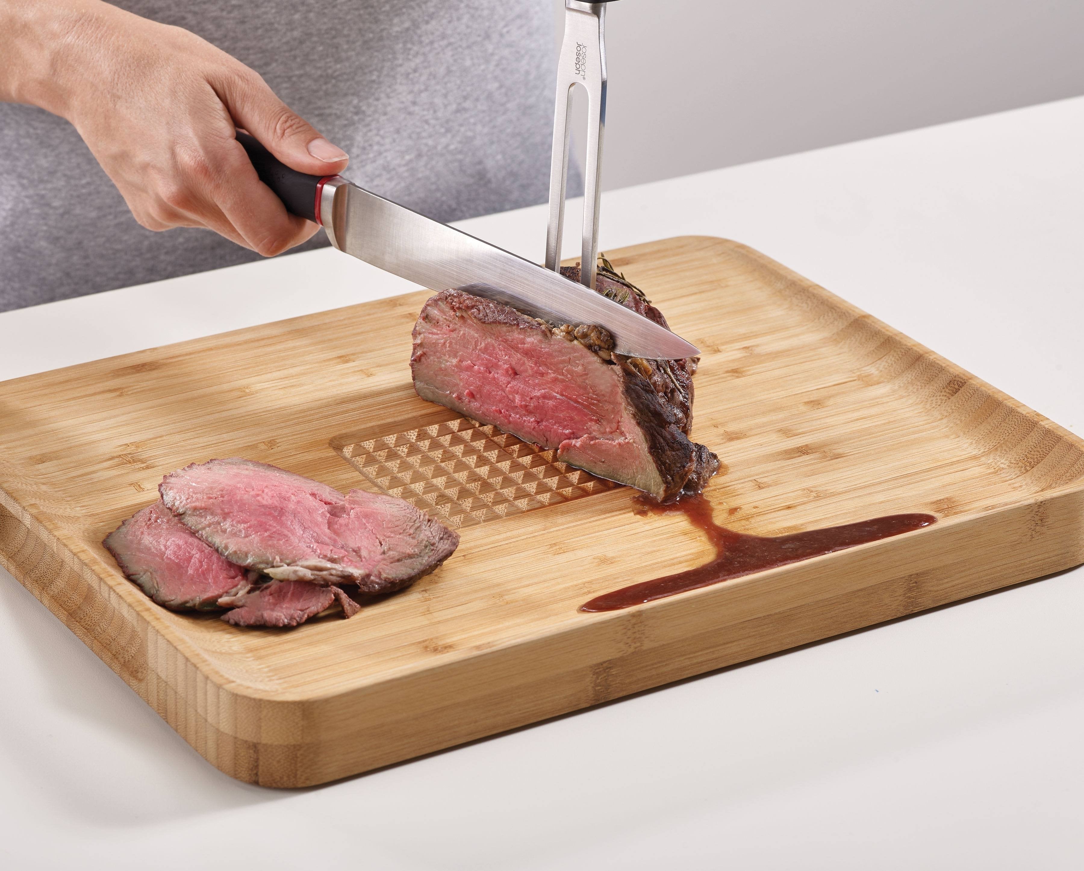 BEON.COM.AU  This heavy-duty bamboo chopping board features an integrated food grip to hold your meat, vegetables or bread in place while you cut and has an angled surface to collect any meat juices or breadcrumbs.  Angled cutting surface catches meat juices and bread crumbs Central food grip for holding mea... Joseph Joseph at BEON.COM.AU